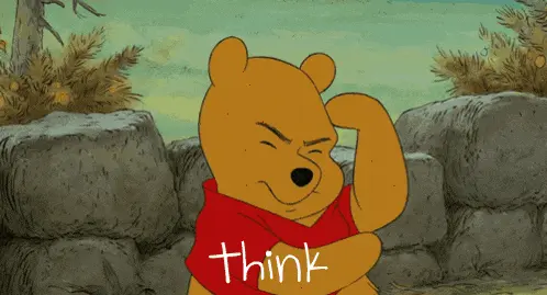 Winnie the Pooh with his hand on his chin, thinking.