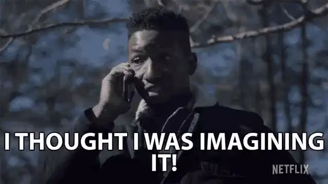 A man on a phone looks concerned and says "I thought I was imagining it!" in a dark, outdoor scene