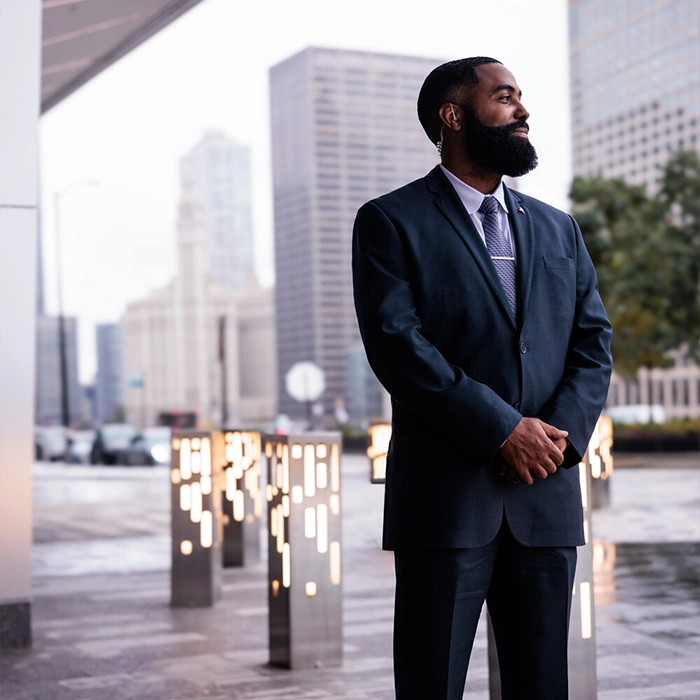 Professionally dressed Marriott employee smiling.