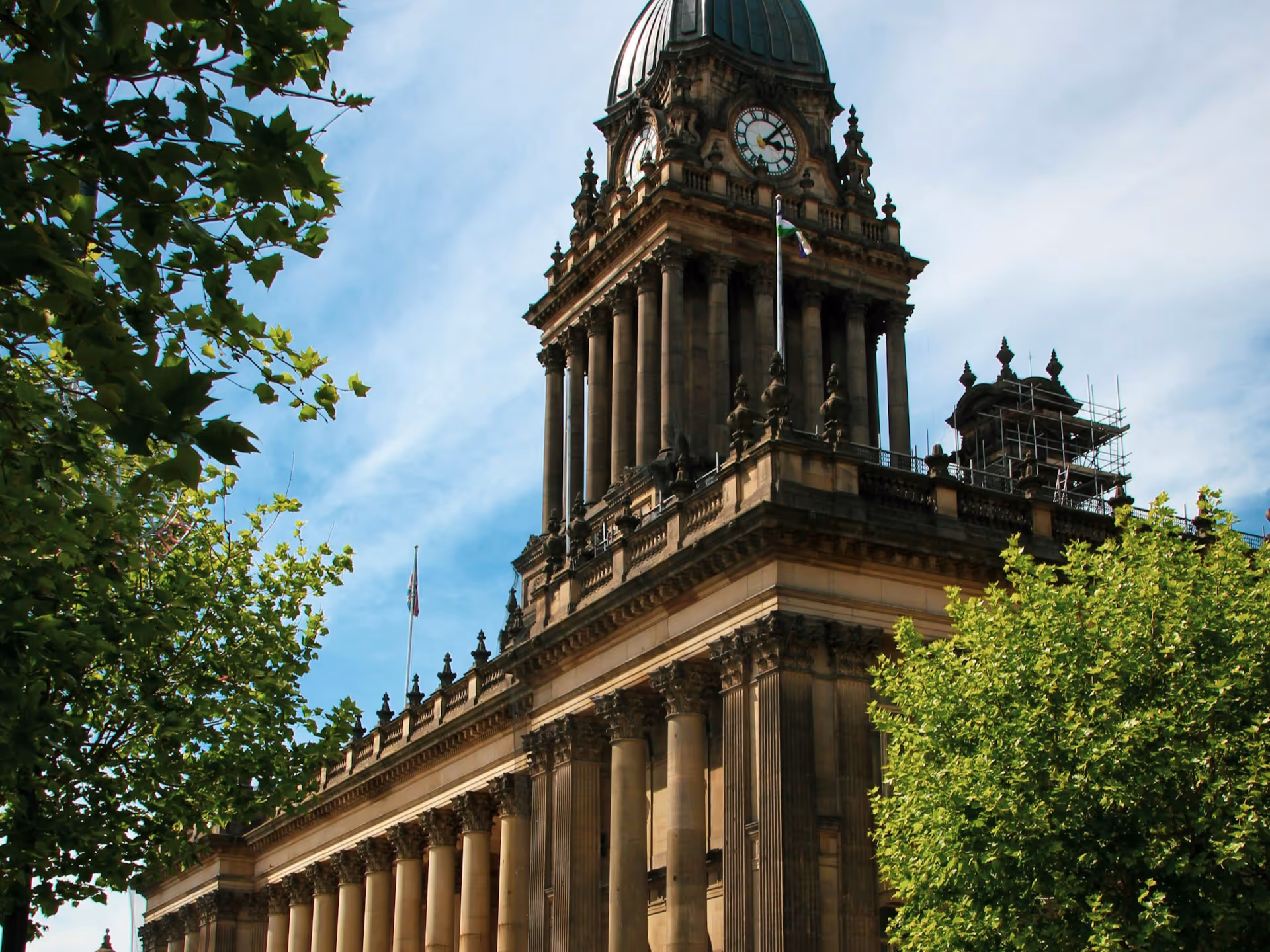A workshop attendee holding a tool that Gary shared during a conference presentation.
