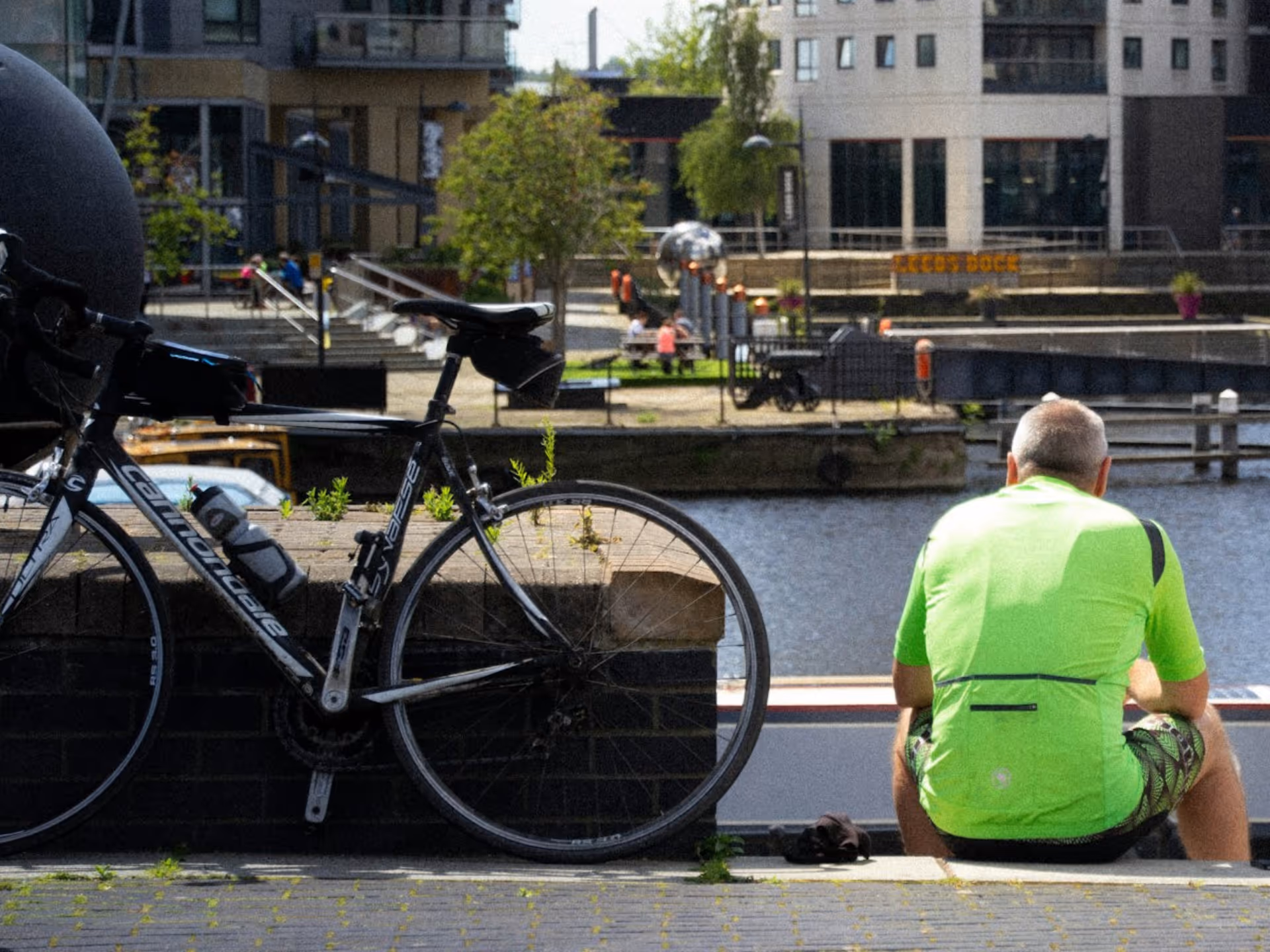 A photo of Gary talking to a small group of colleagues.