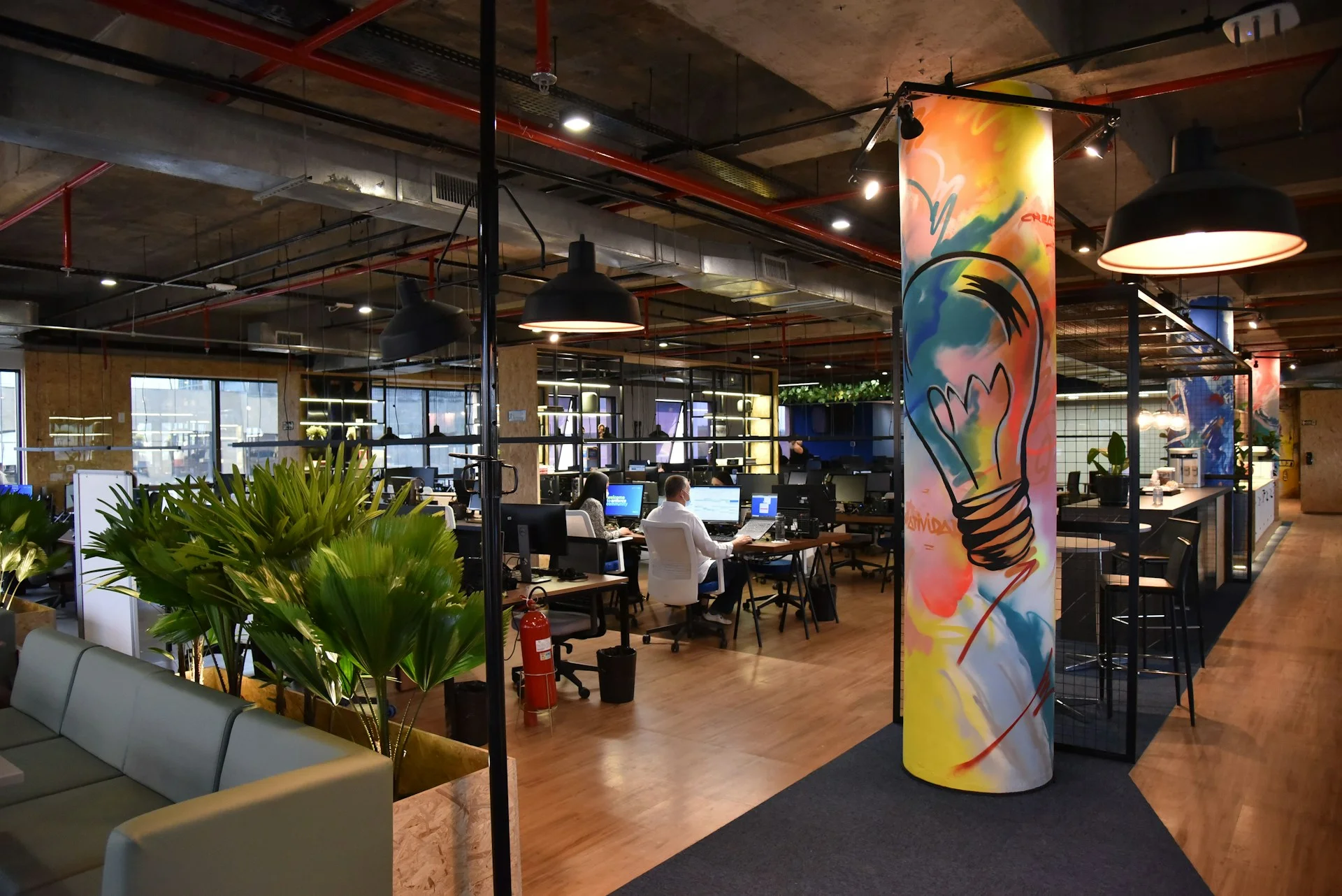 A warm, inspiring, comfortable office workspace which prioritises collaboration.