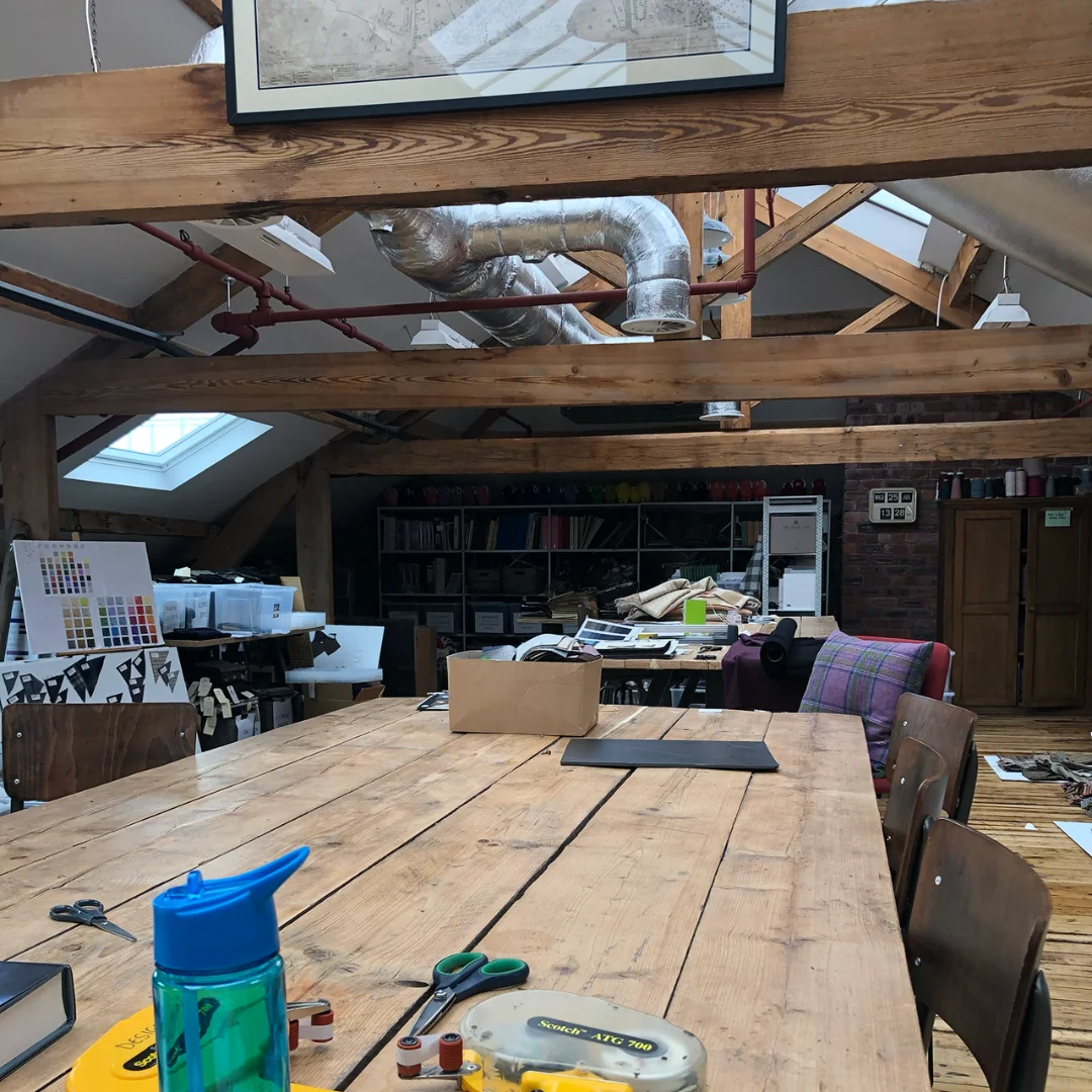 A photo of Abraham Moon's design room, which is full of textile history and inspiration. 