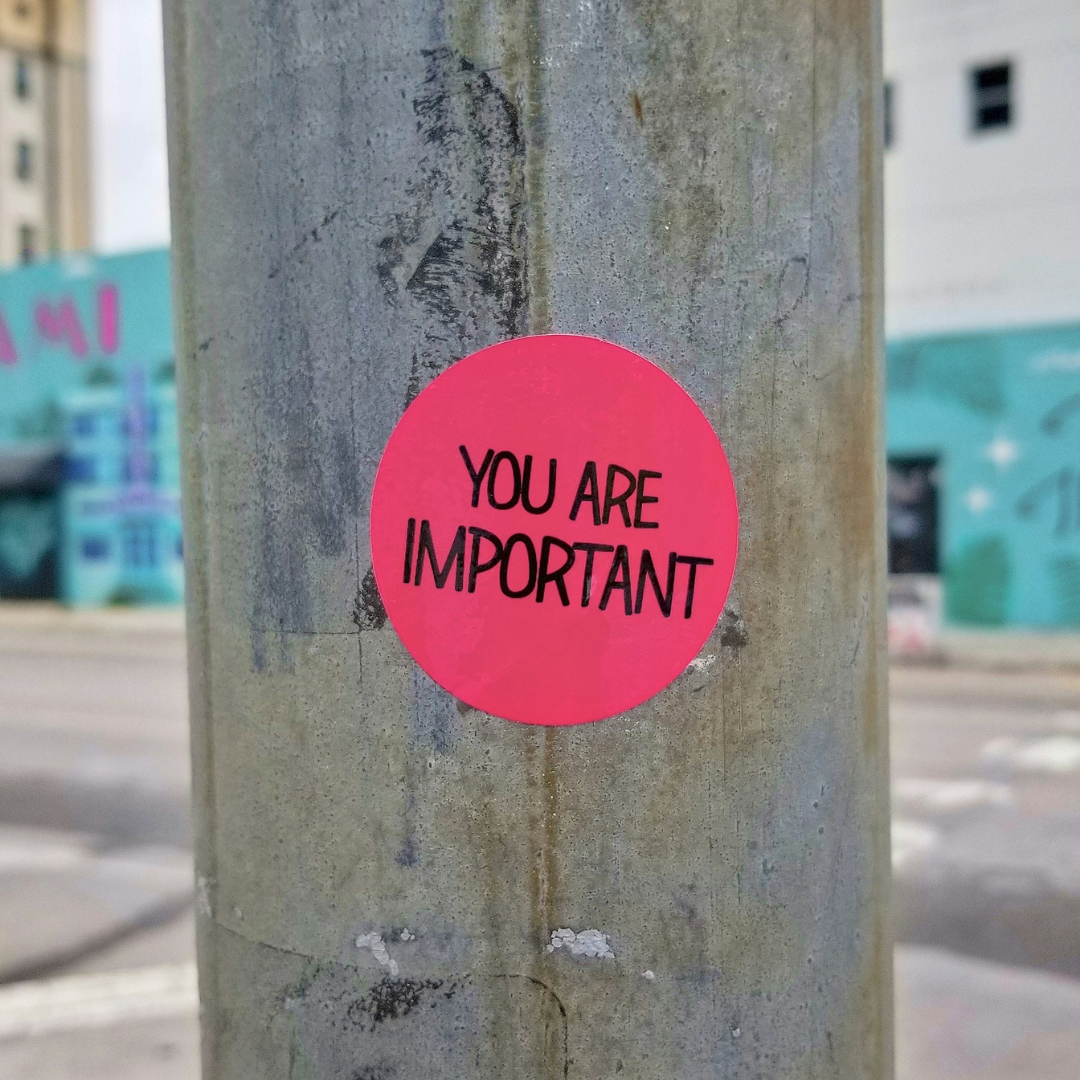 A photo of a sticker on a telegraph poll which reads "You are important".