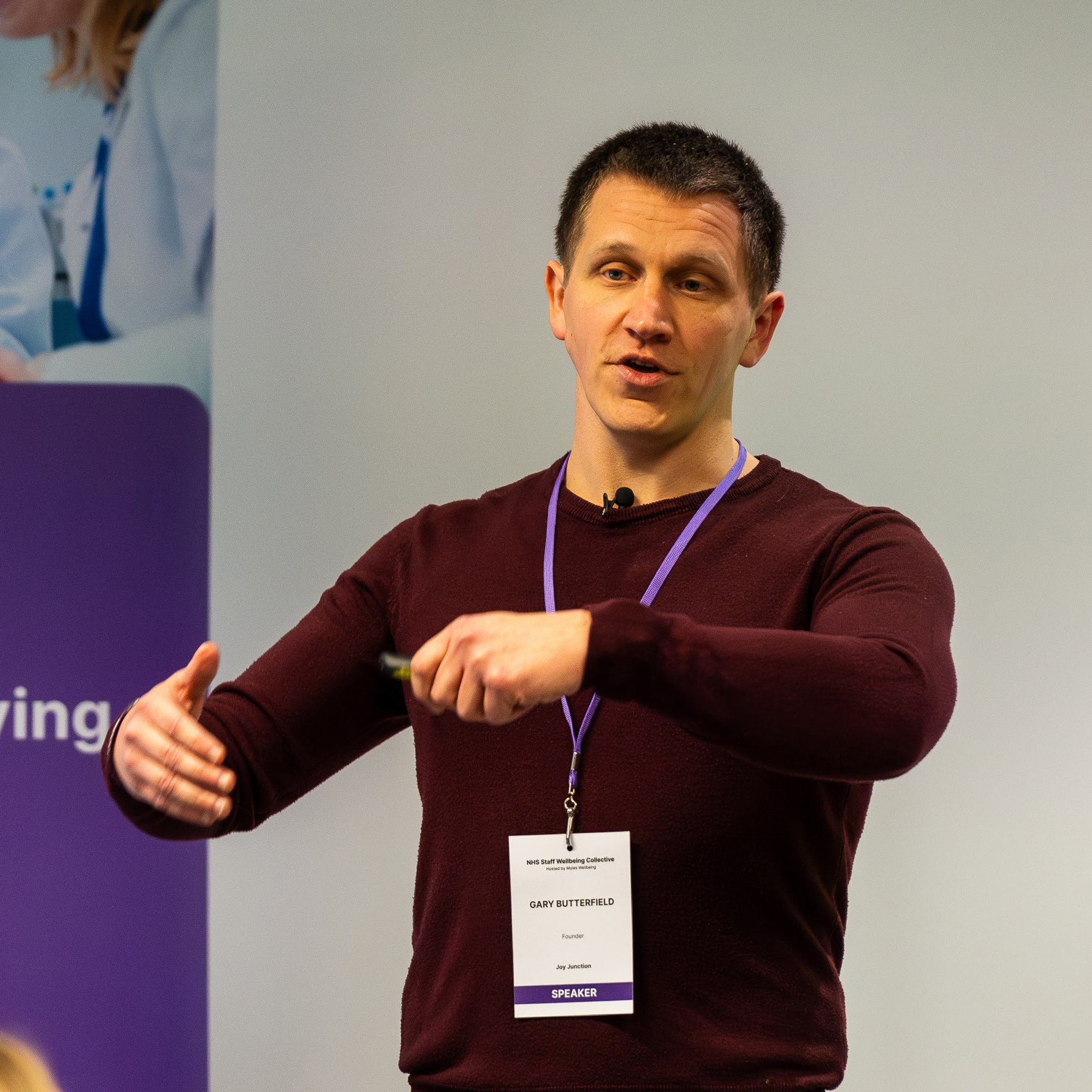 A photo of Gary presenting at a conference. 