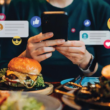 a person on social media while in front of their food