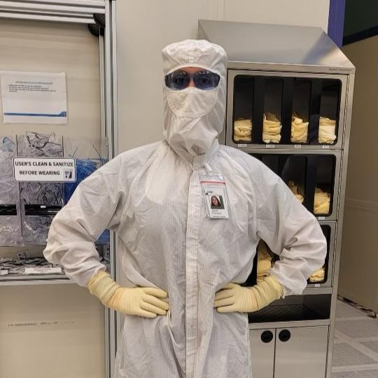 A woman, Jamie, in a semiconductor manufacturing bunny suit.