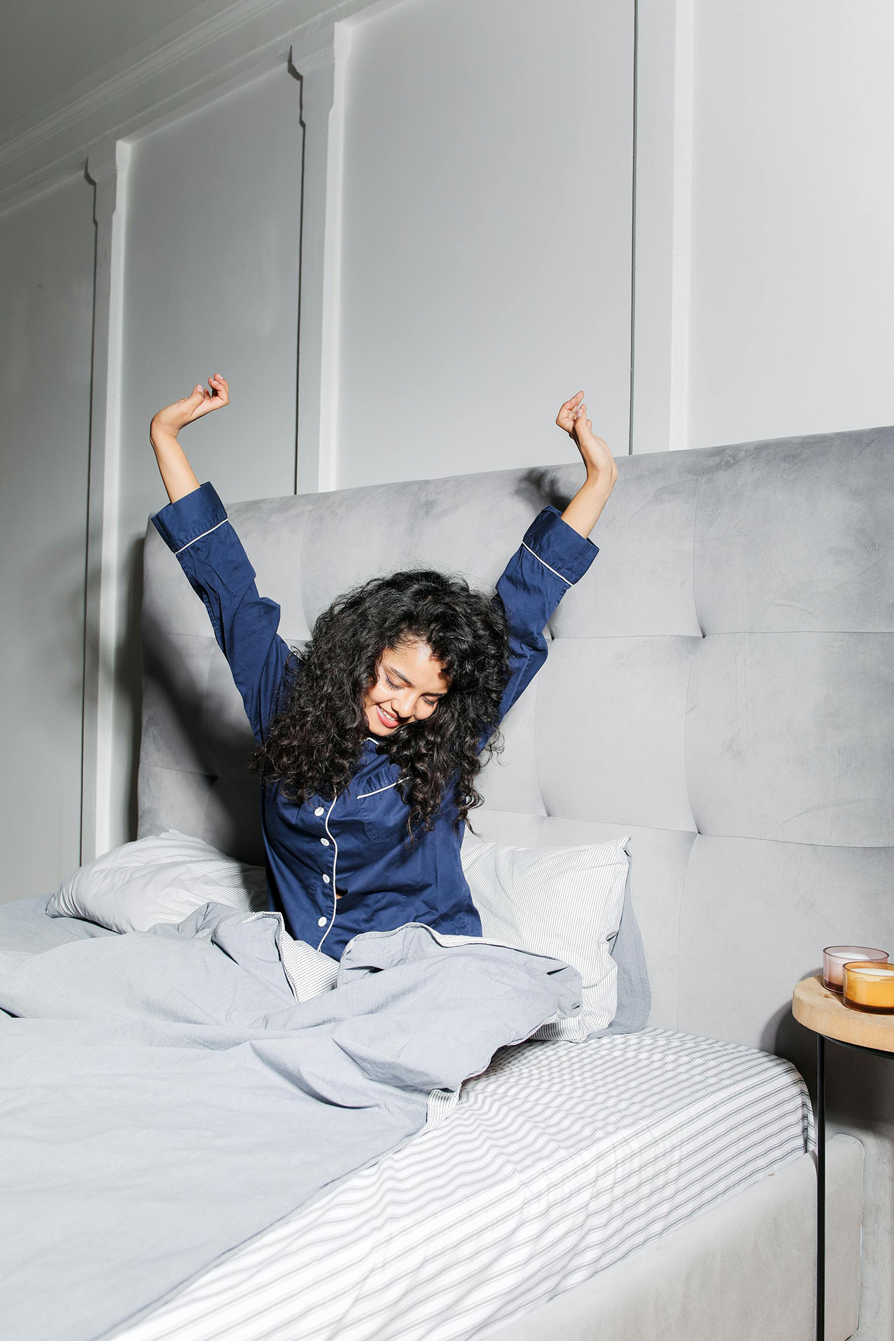 Woman waking up in a hotel