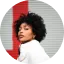 Young professional woman in Dallas smiles confidently as a career coach, thriving in her profession. Preem Coaching & Mentoring Services in Dallas TX