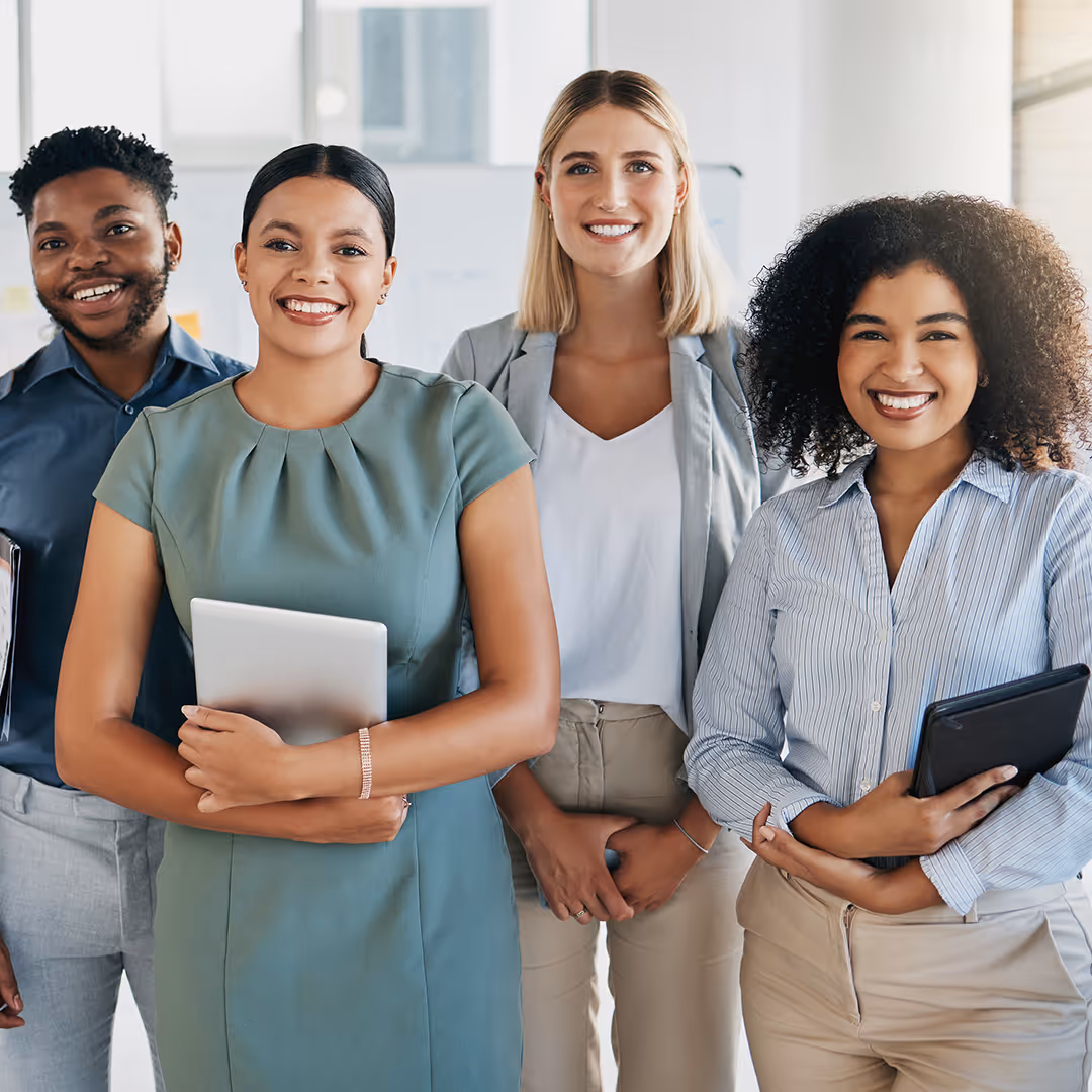 Young professionals network and collaborate in a dynamic Dallas office setting with technology. Preem Coaching & Mentoring Services in Dallas TX