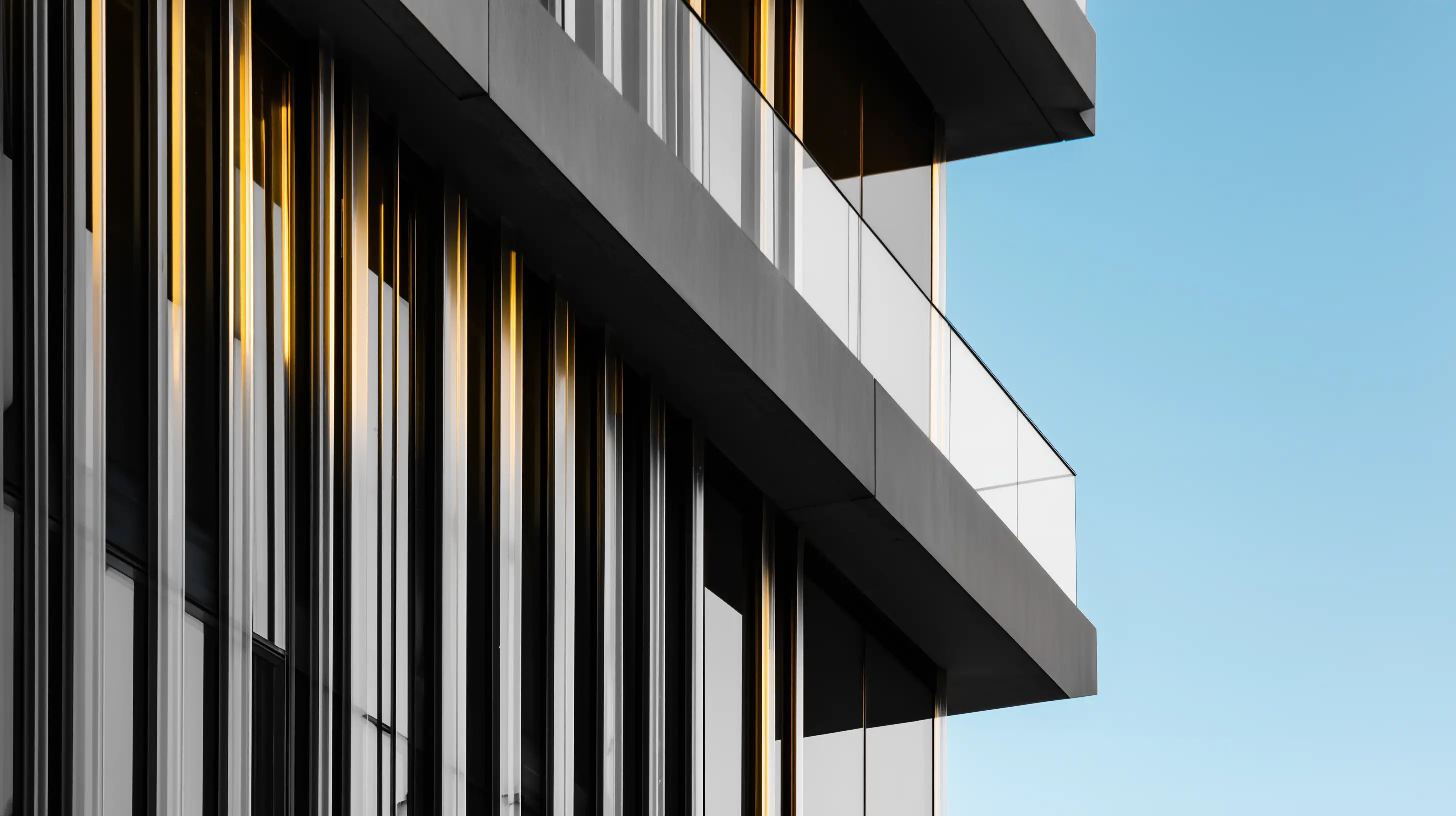Modern building facade with glass panels and clean architectural lines.