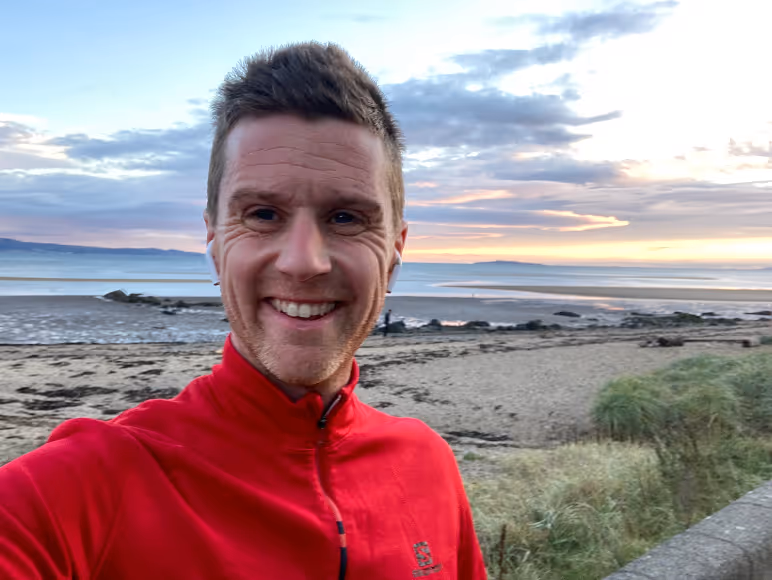 selfie of jamie at cramond beach with the beach and sea behind