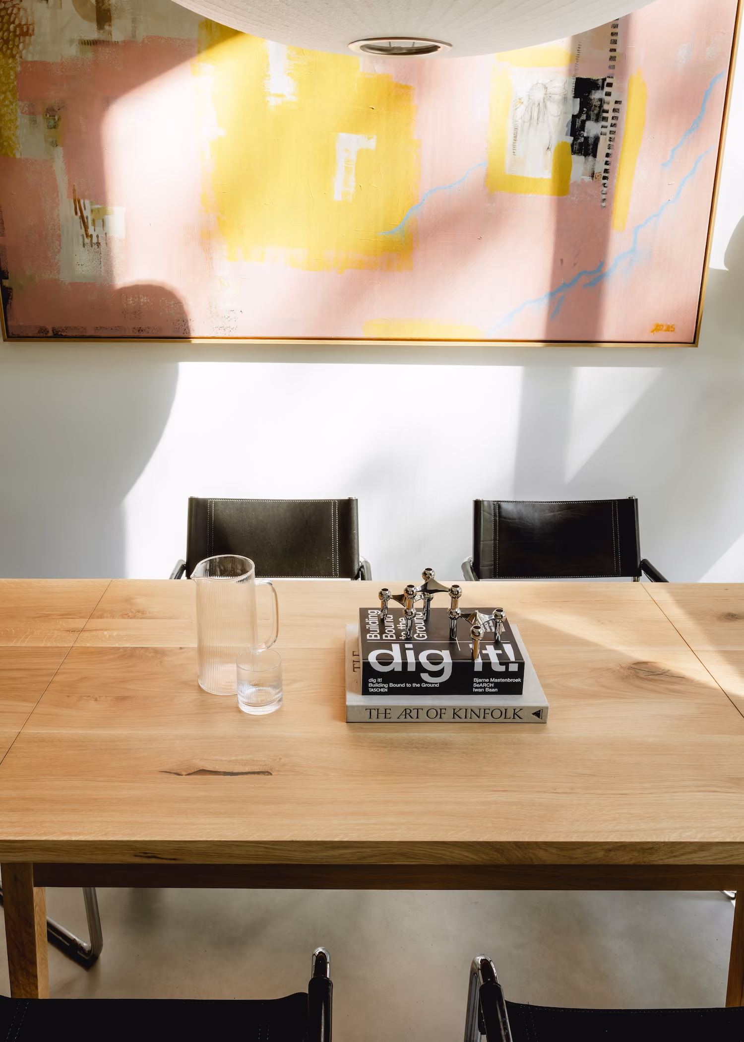 The same oak table after restoration, with an even, light tone across the whole top