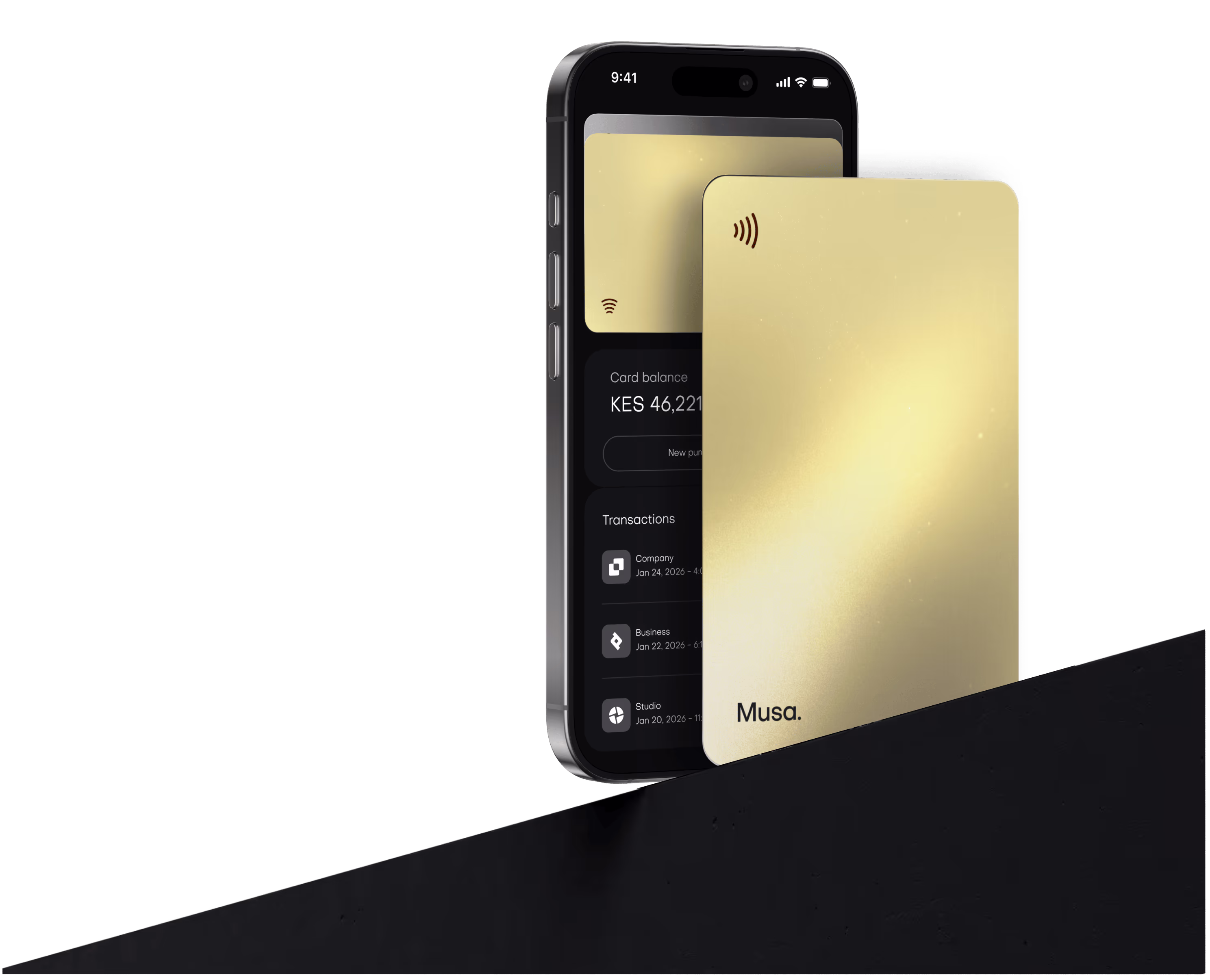 A golden credit card in front of a phone displaying a card app.