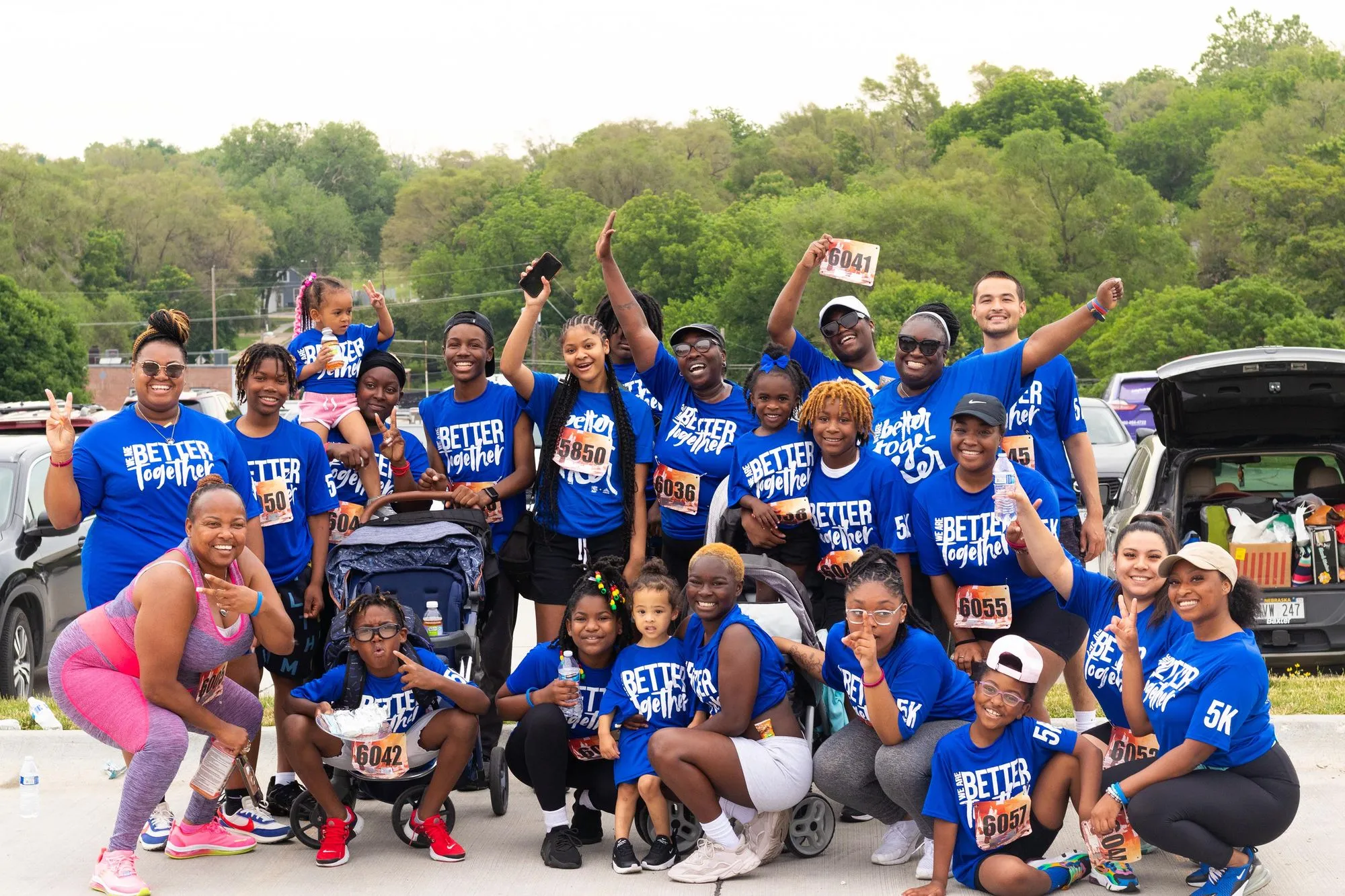 A group of people in blue shirts posing for a picture.