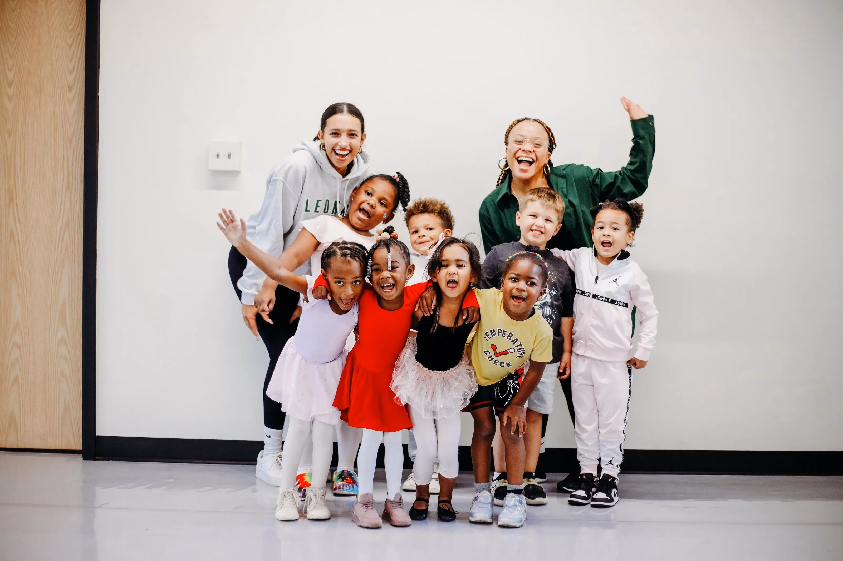 A group of children standing next to each other.