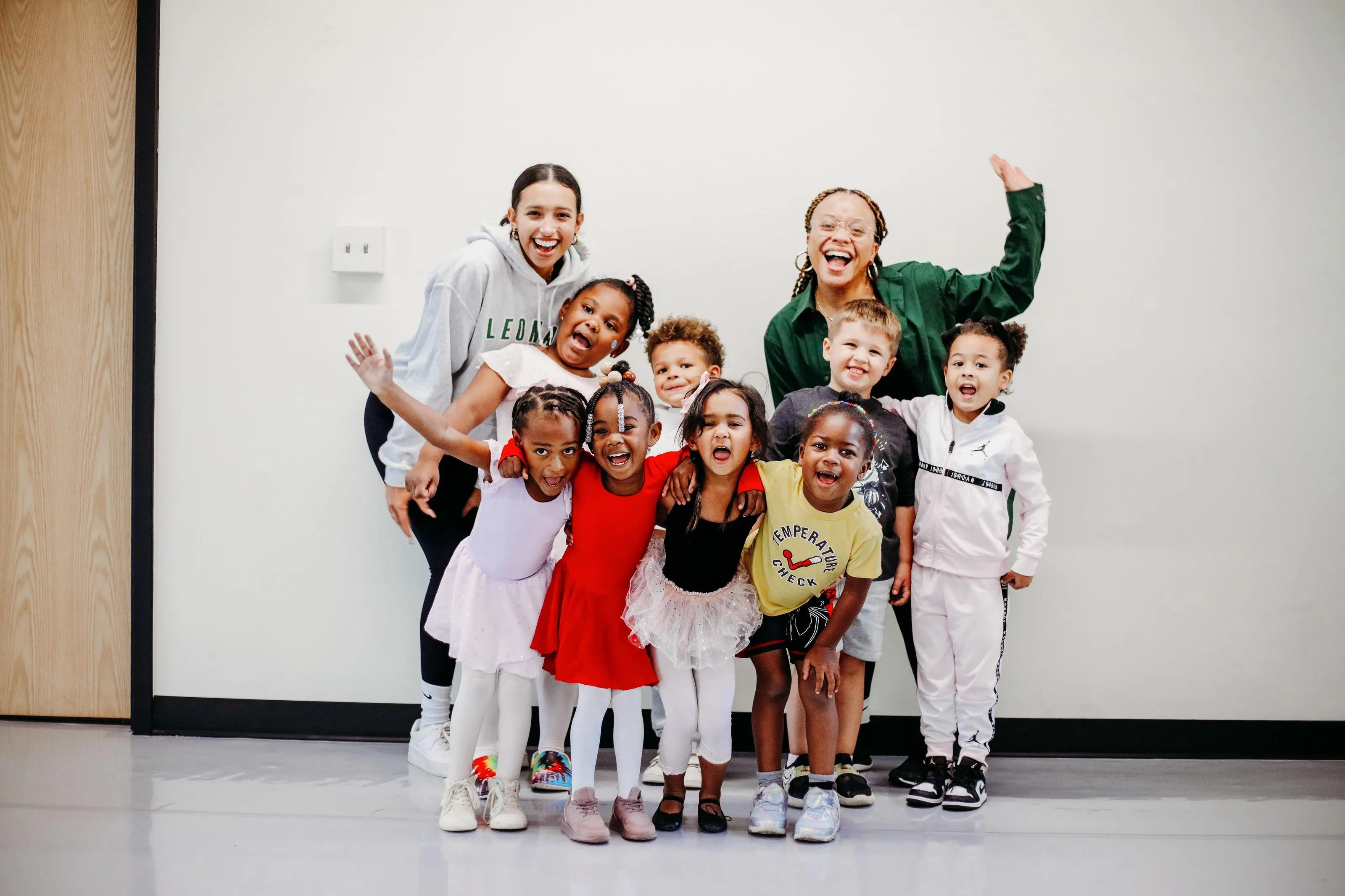 A group of children standing next to each other.