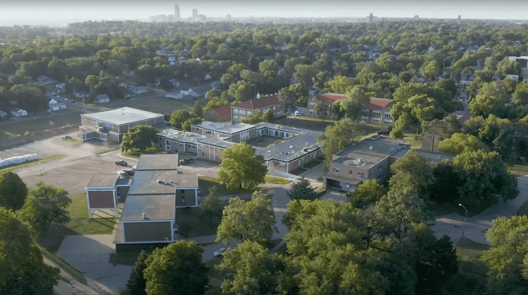 An aerial view of a city with lots of trees.