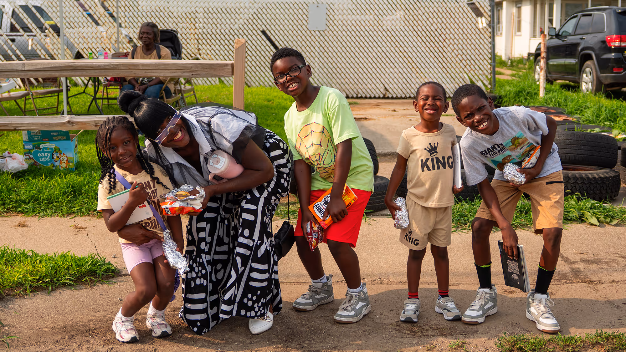 A group of young children standing next to each other.