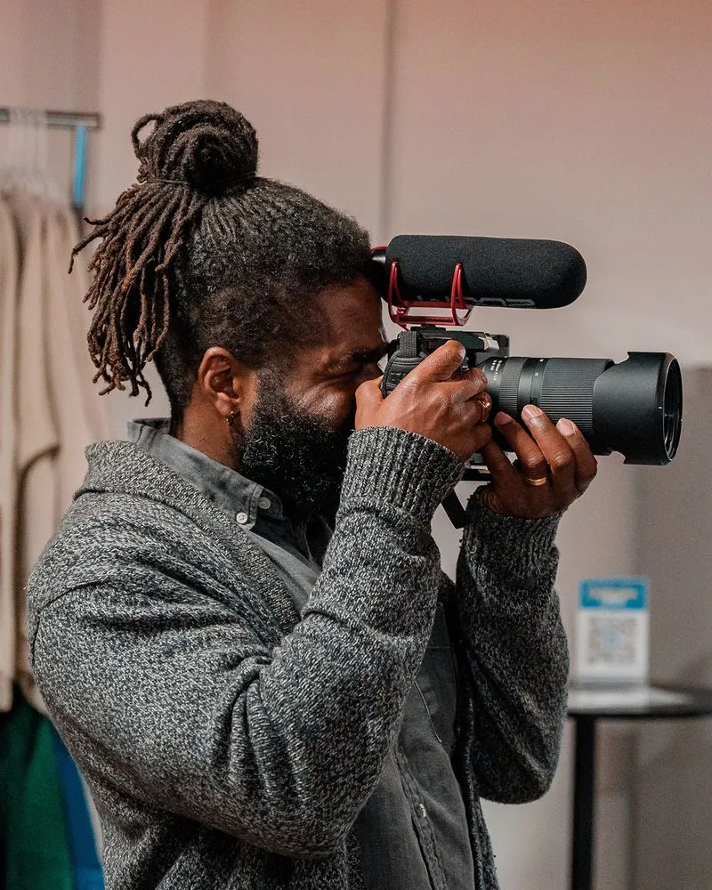 A man taking a picture with a camera.