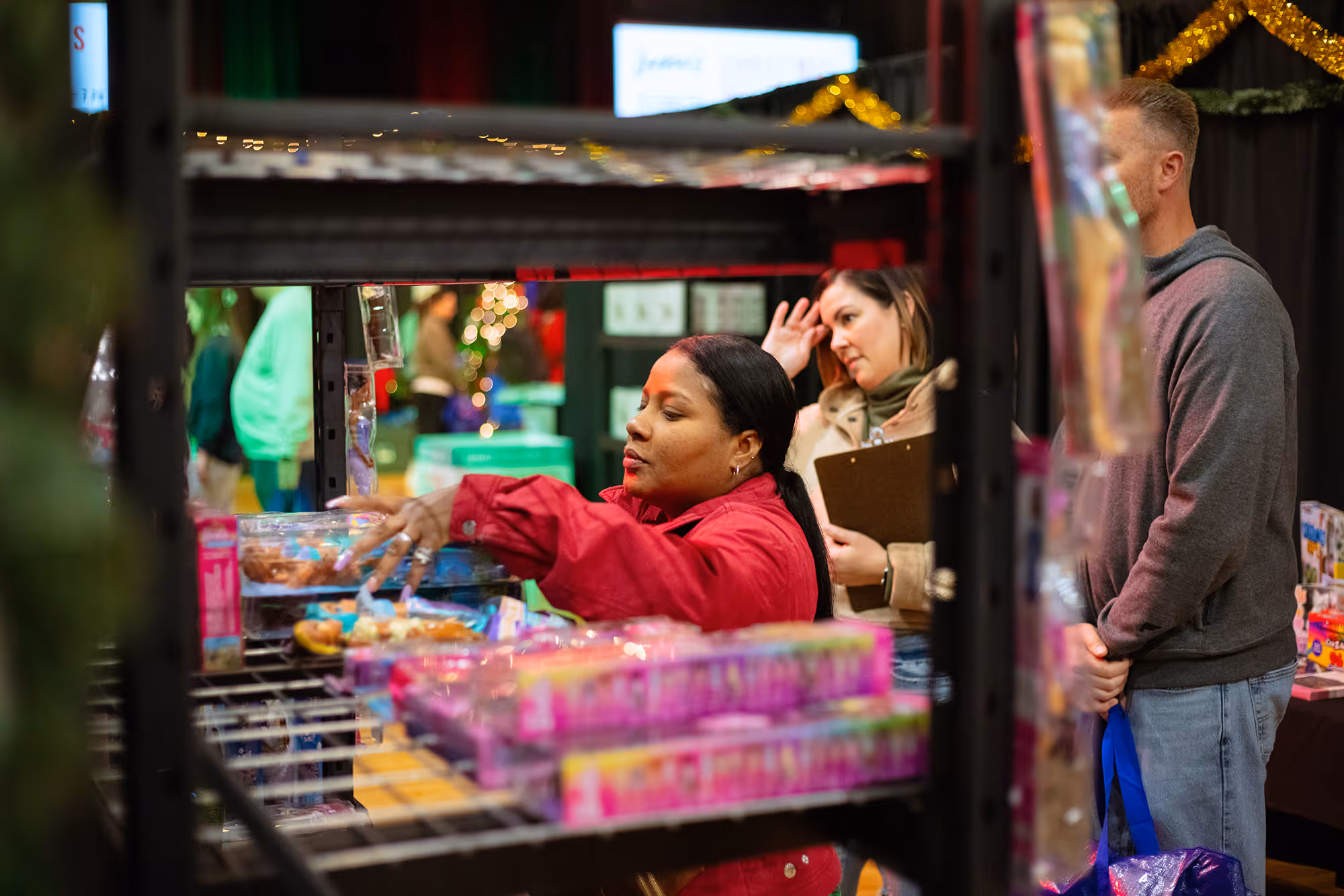 A man and a woman looking at items in a store.