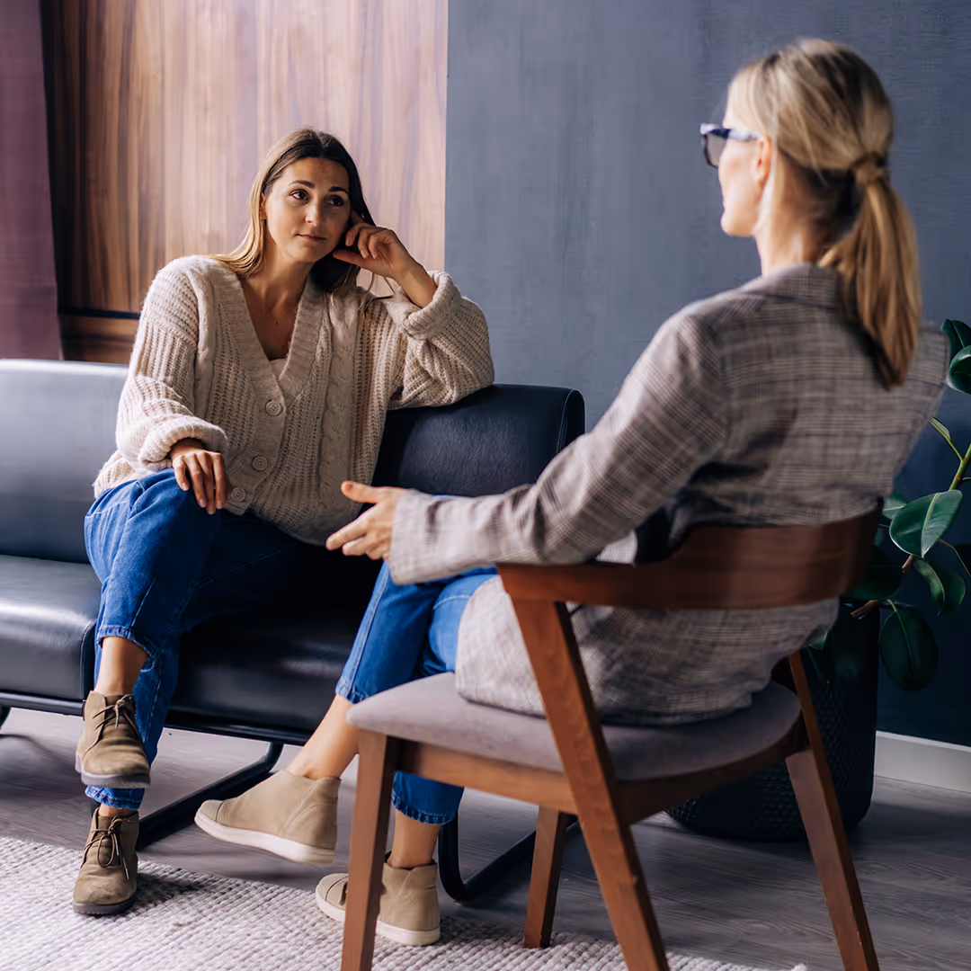 Two white females talking in a therapy calm therapy setting. Individual therapy at Therapy Academy in Frisco TX