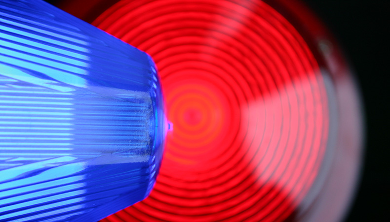 Photo of police car with blue lights