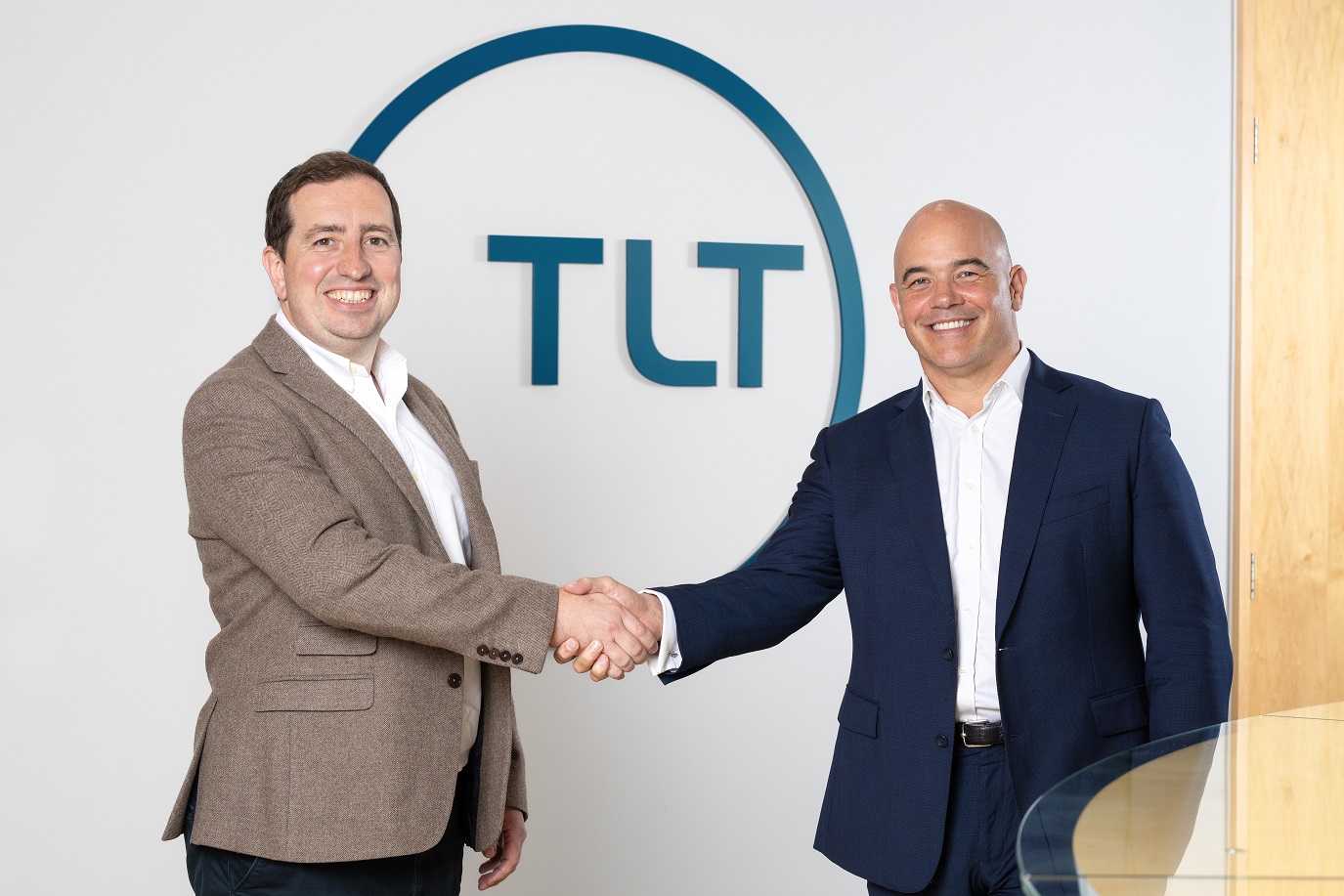 Chris Elwell-Sutton shaking hands with Gareth Oldale