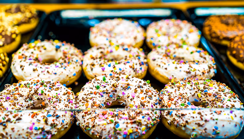 Shop workers at till