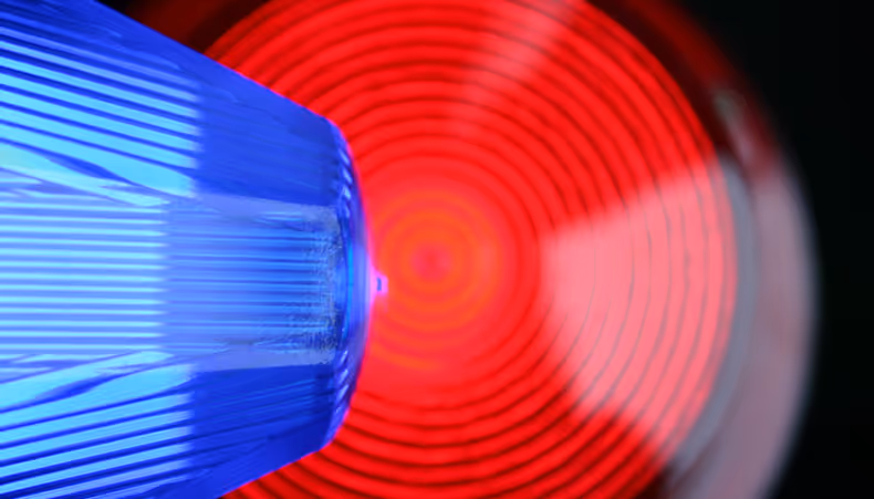 Photo of police car with blue lights