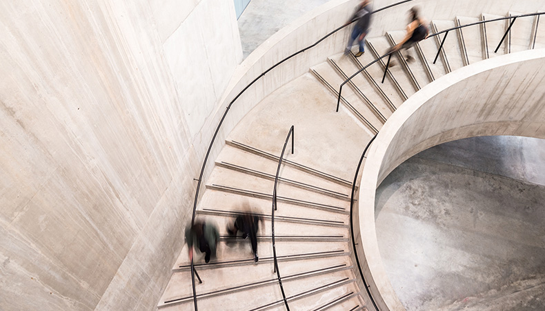 Blurred people walking on stairs