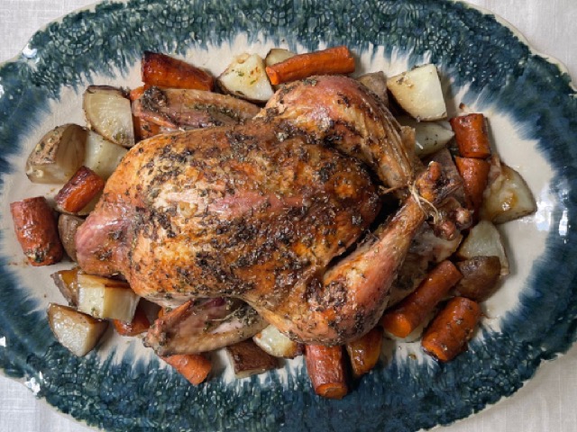 While Herb Roasted Chicken from Rehoboth Market and Root Vegetables from Profound Foods on a plate to be served.