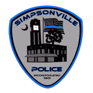 Simpsonville Police badge with building, moon, tree, and flag with a blue stripe.