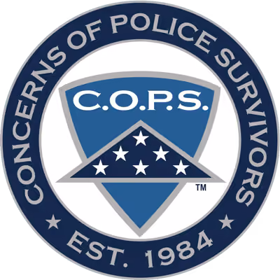 Seal of Concerns of Police Survivors with blue shield and stars, established 1984.
