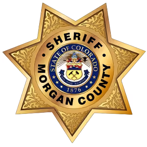 Morgan County Sheriff badge with Colorado state seal and 1876 on a gold star.
