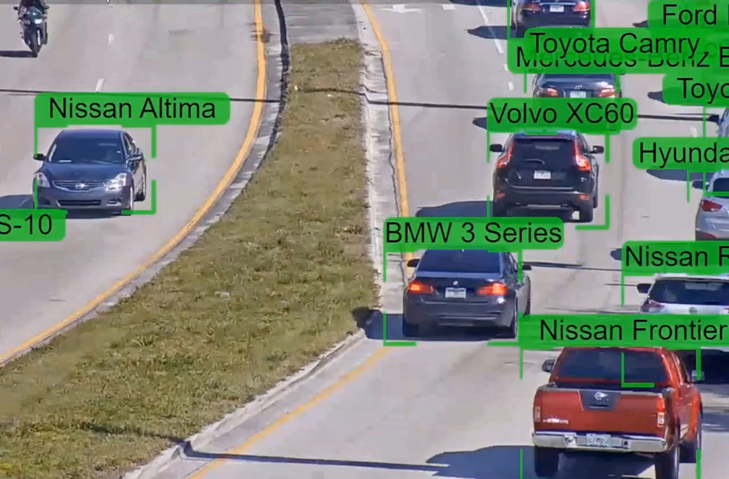 Road traffic with multiple cars labeled by an AI detection system including Nissan Altima, BMW, Volvo, and Toyota Camry.