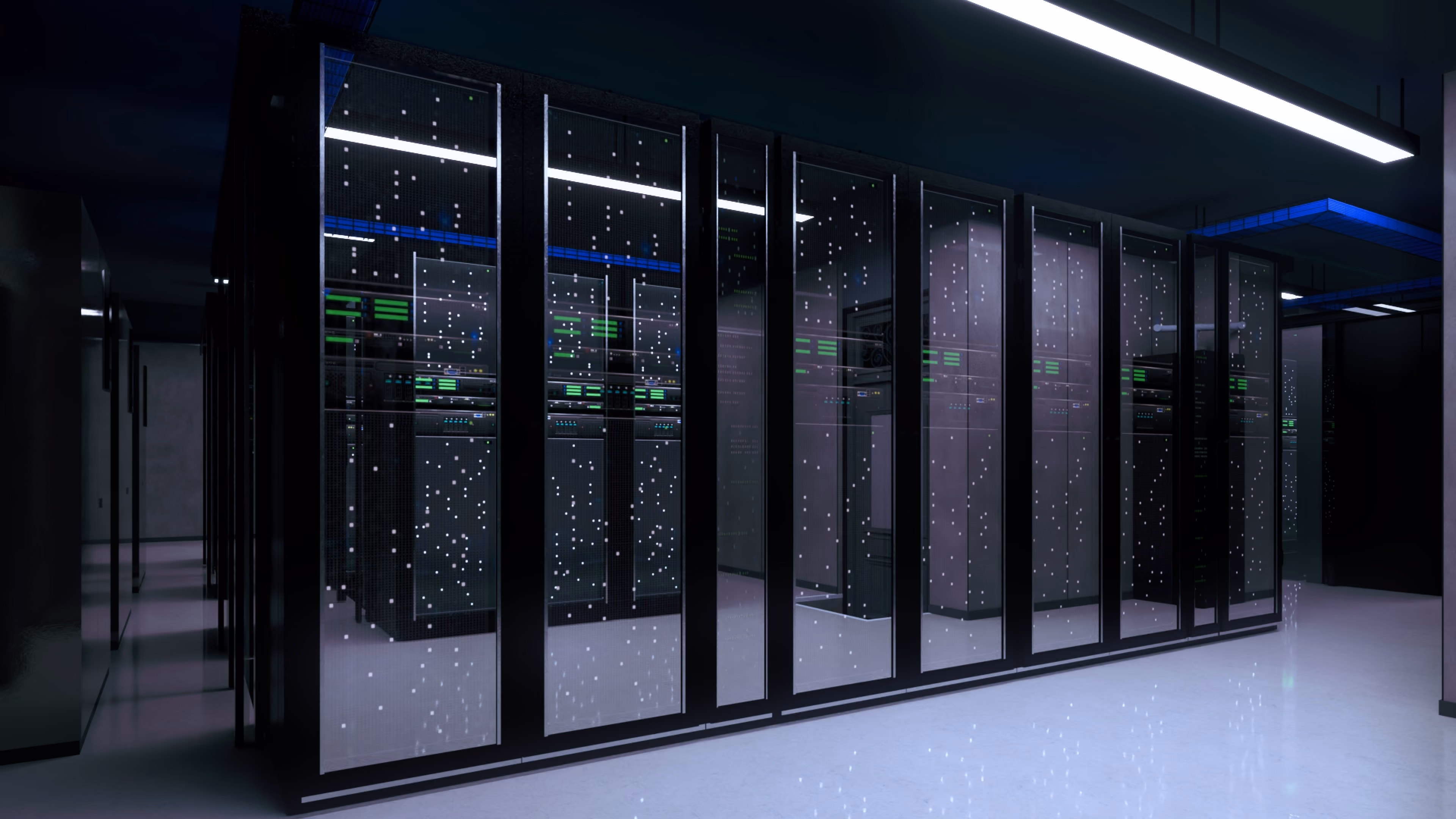 Rows of black server racks with blinking lights inside a dimly lit data center room.