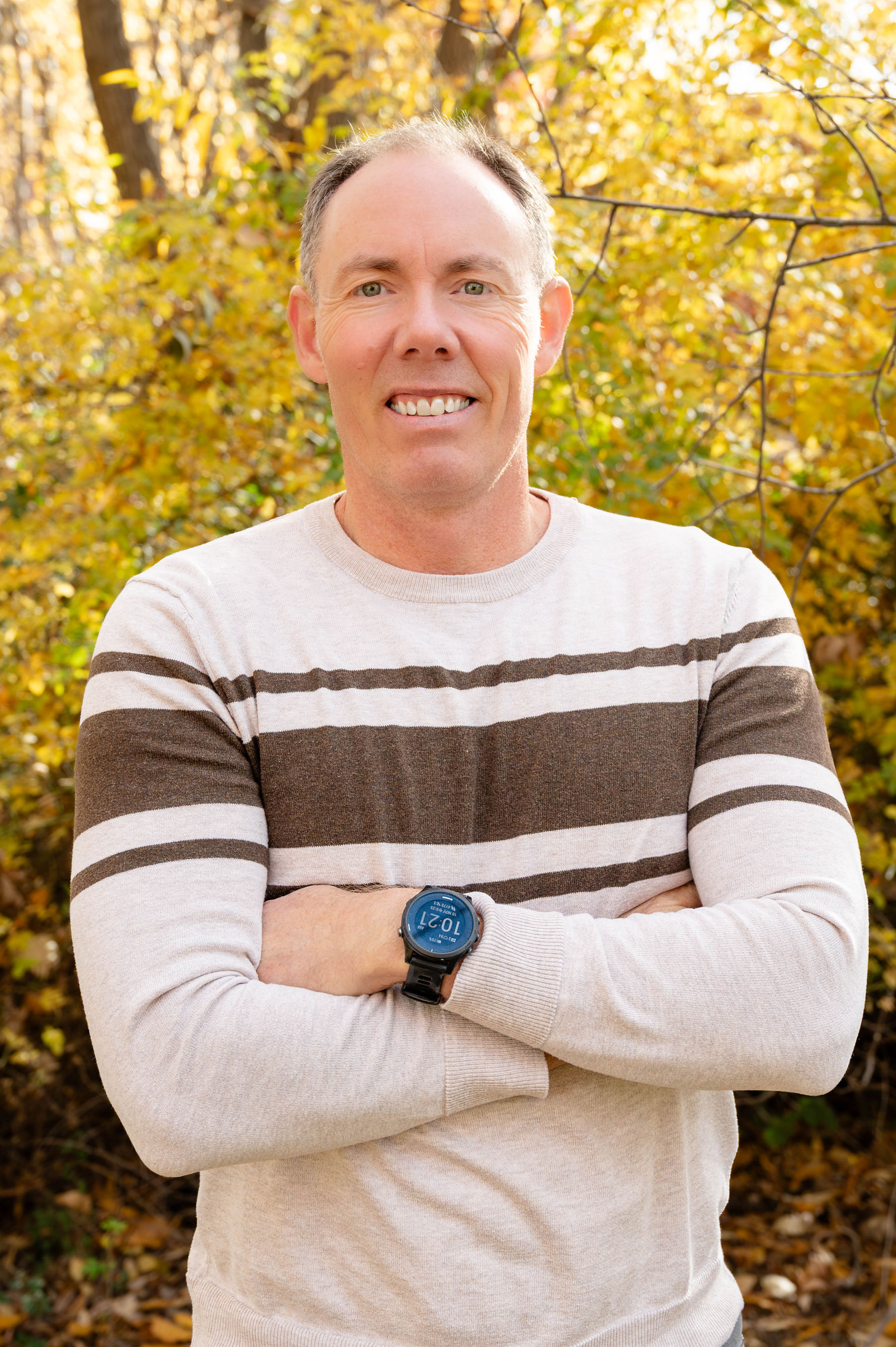 Greg Burnham smiling outdoors