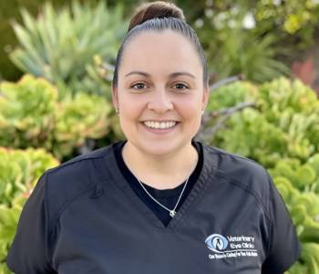 Professional picture of a woman wearing grey scrubs.
