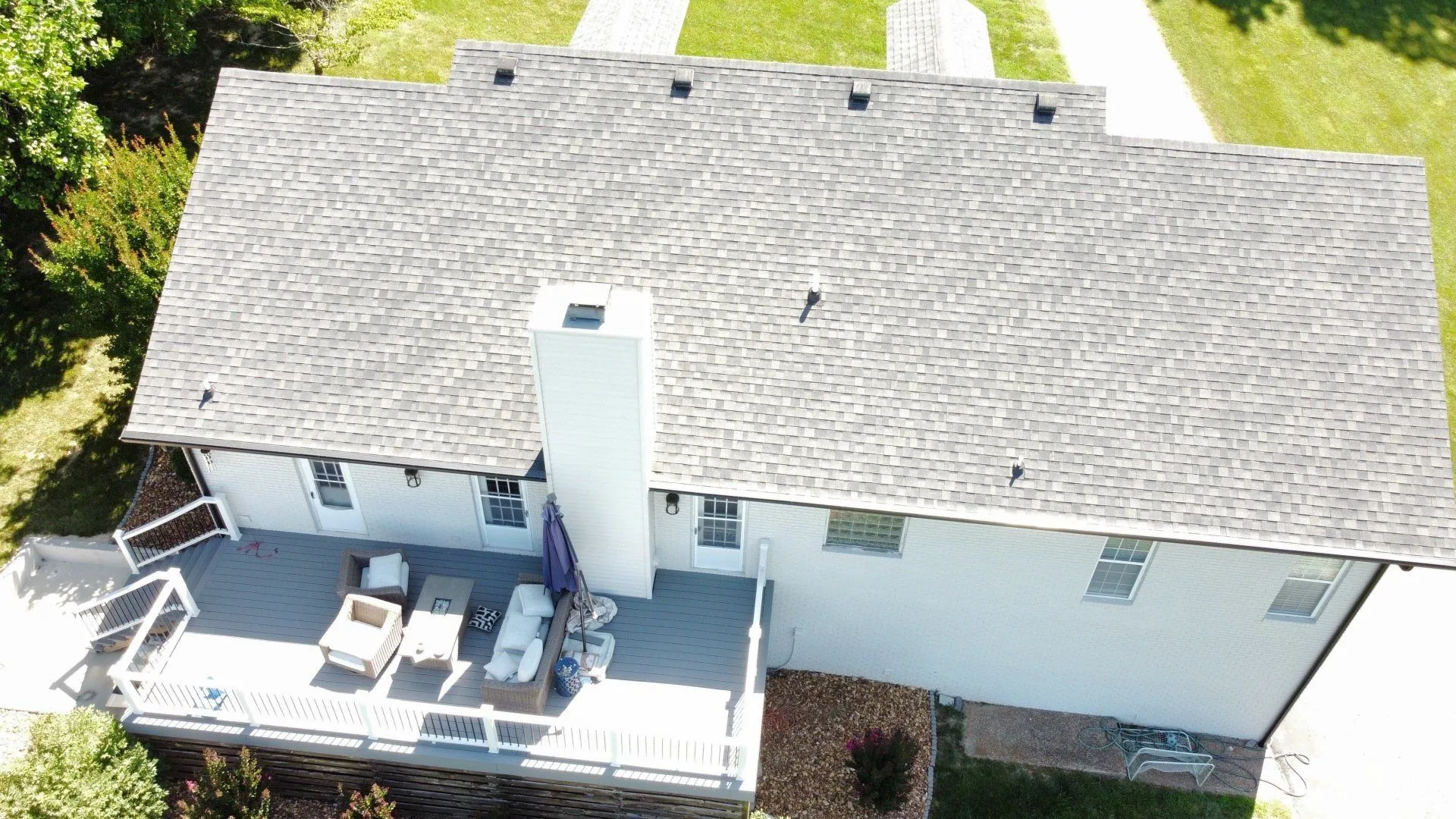Completed residential roofing project with high-performance asphalt shingles