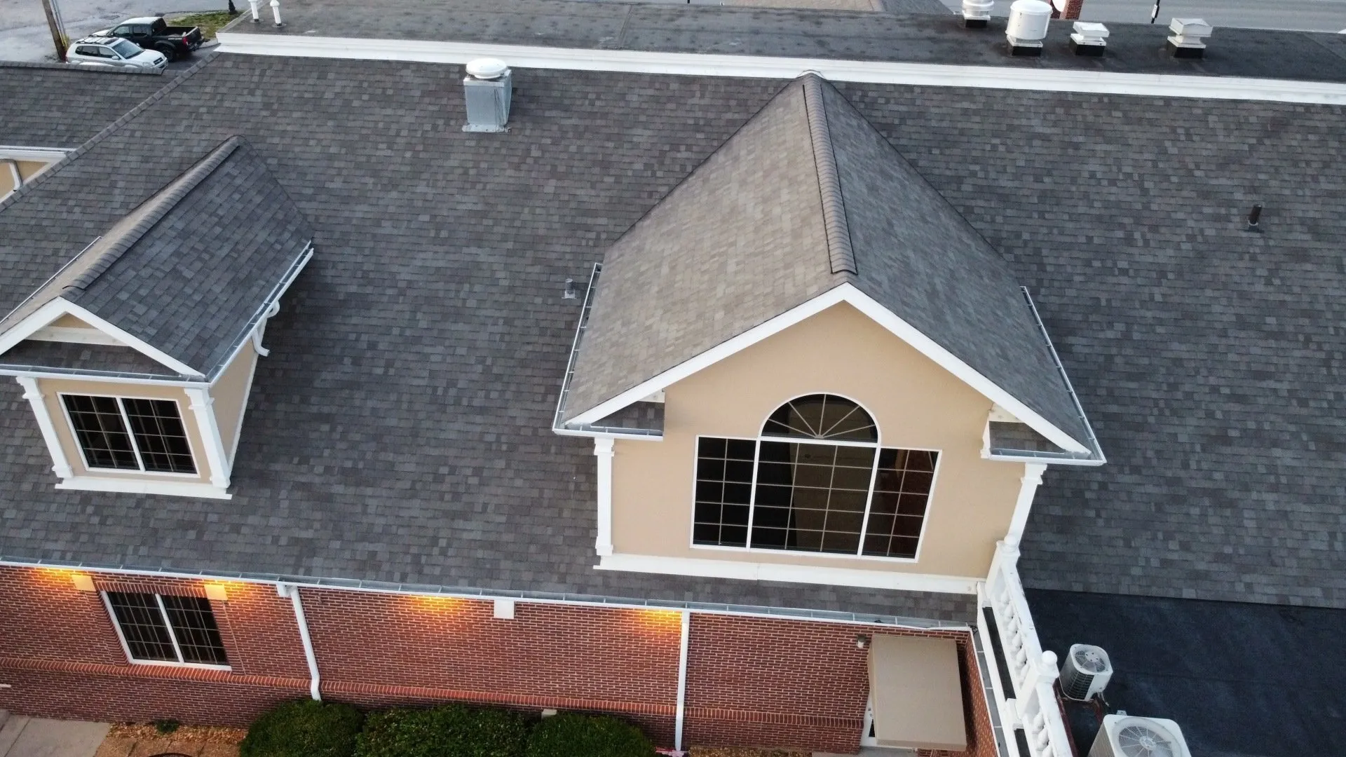 Residential roofing hero image showcasing beautiful shingle roof under blue sky