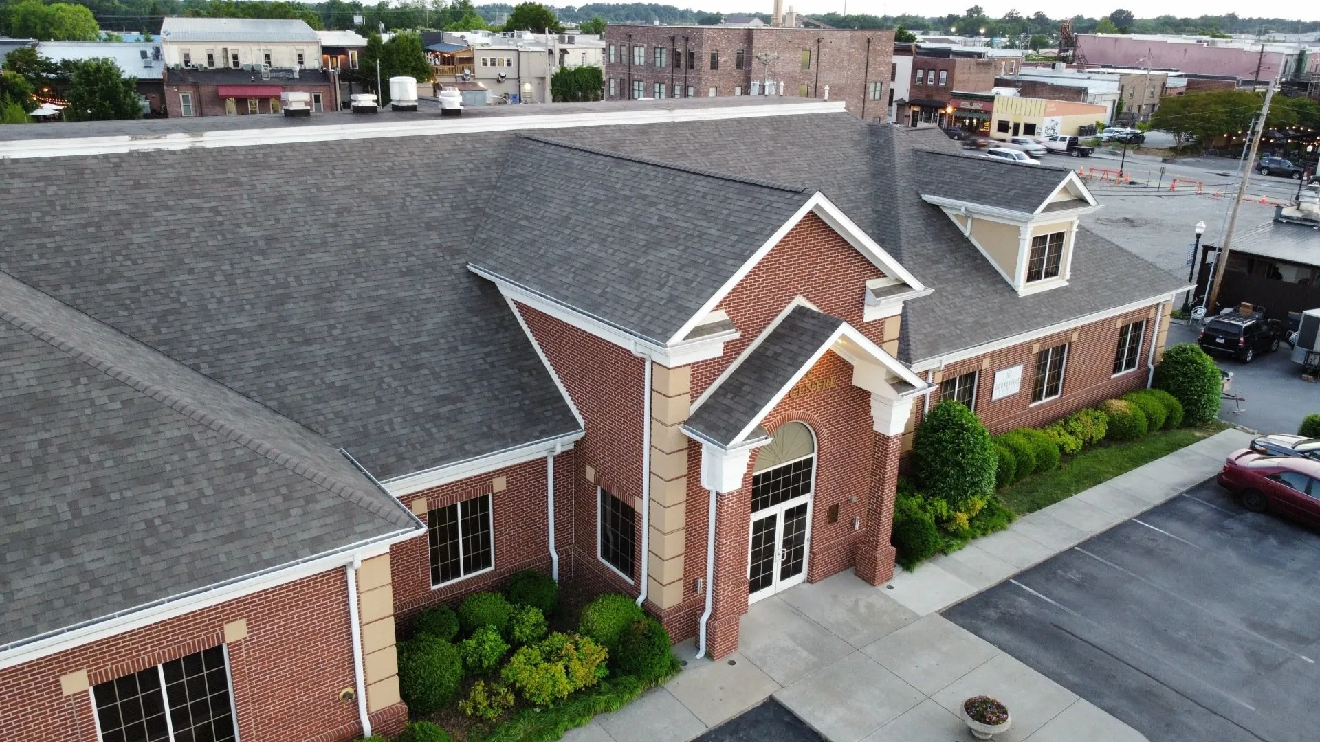 Top view of commercial roof showing newly applied membrane and vents