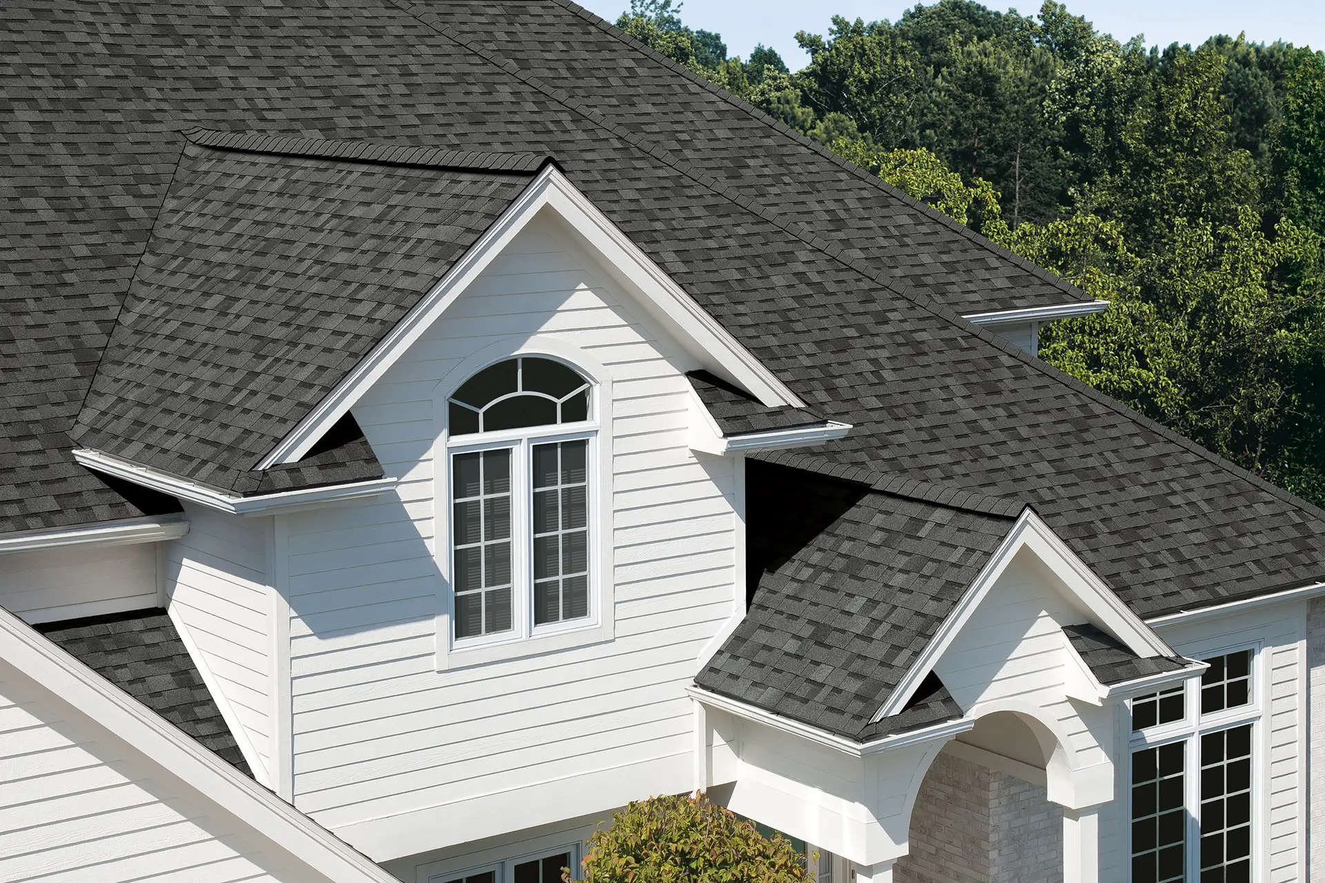 Owens Corning Summer Harvest shingles displayed on a designer home