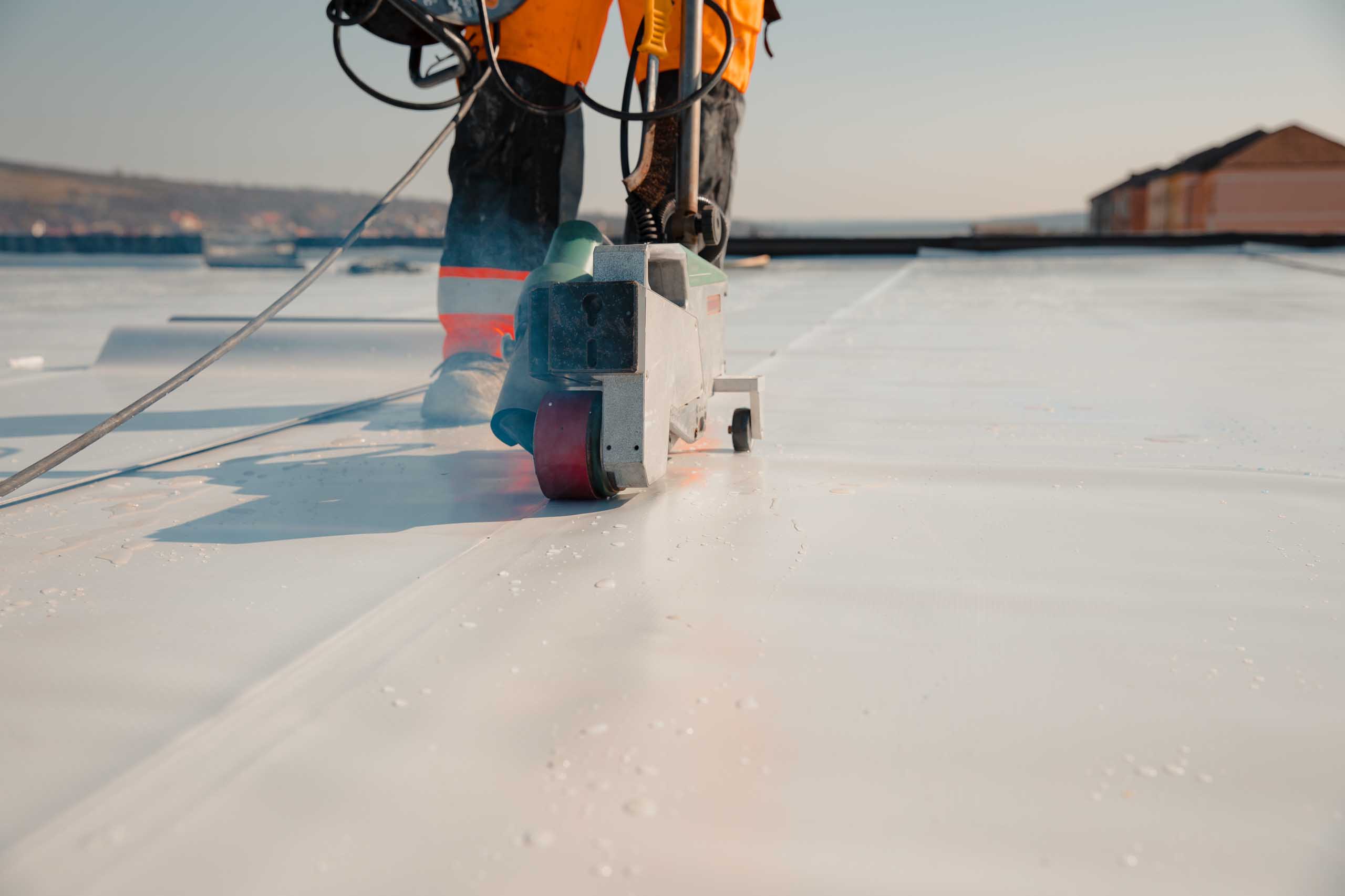 Protective covering on flat commercial roof during installation