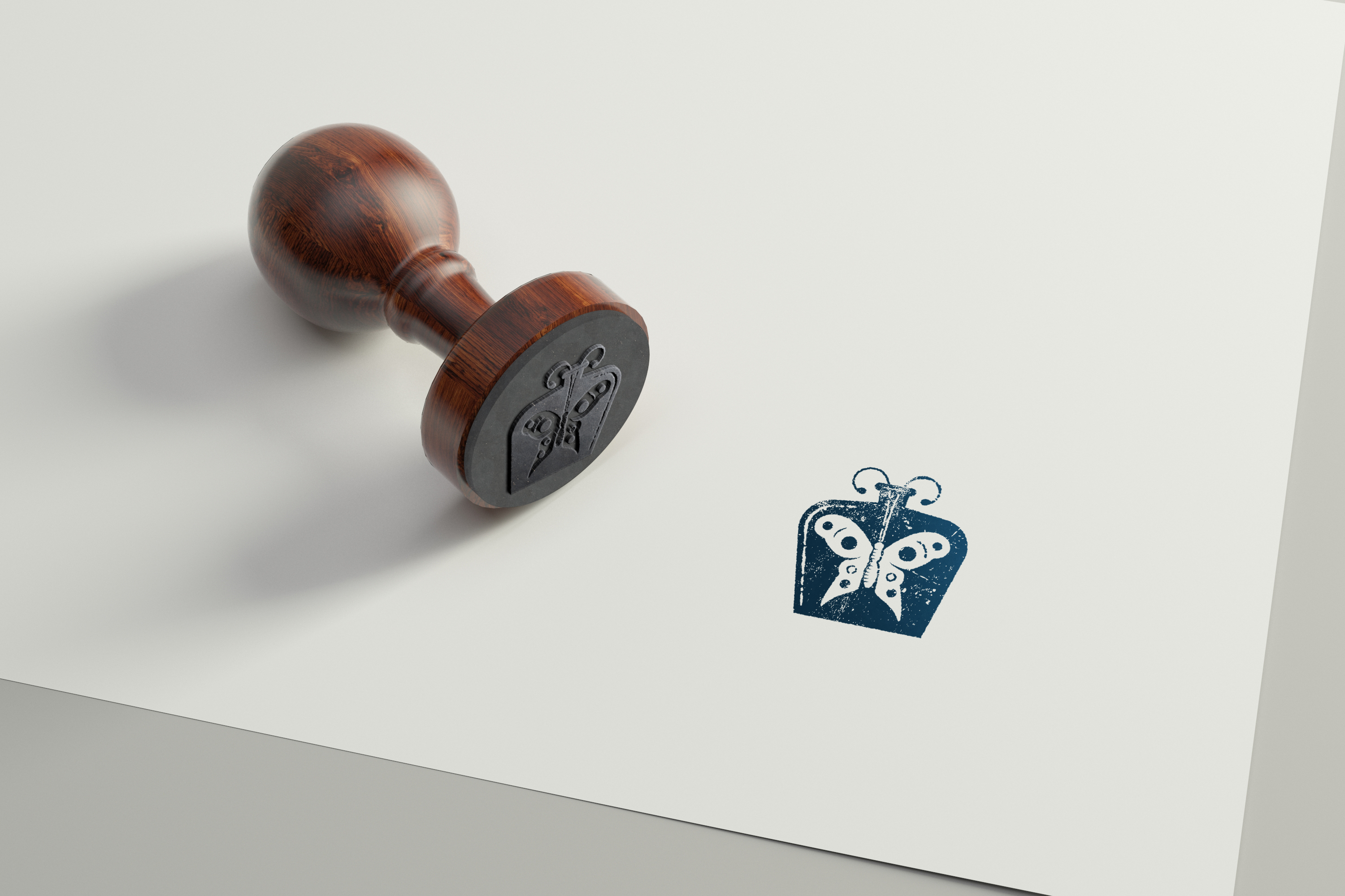 Wooden rubber stamp with a reduced Francis logo next to its stamped impression