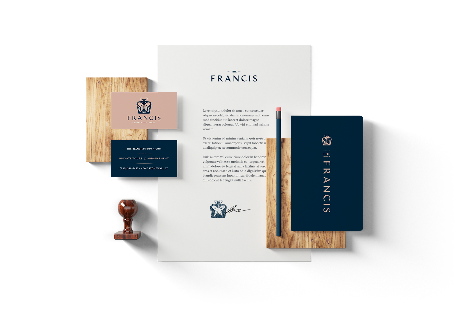 The Francis brand identity mockup with stationery, letterhead, and business card