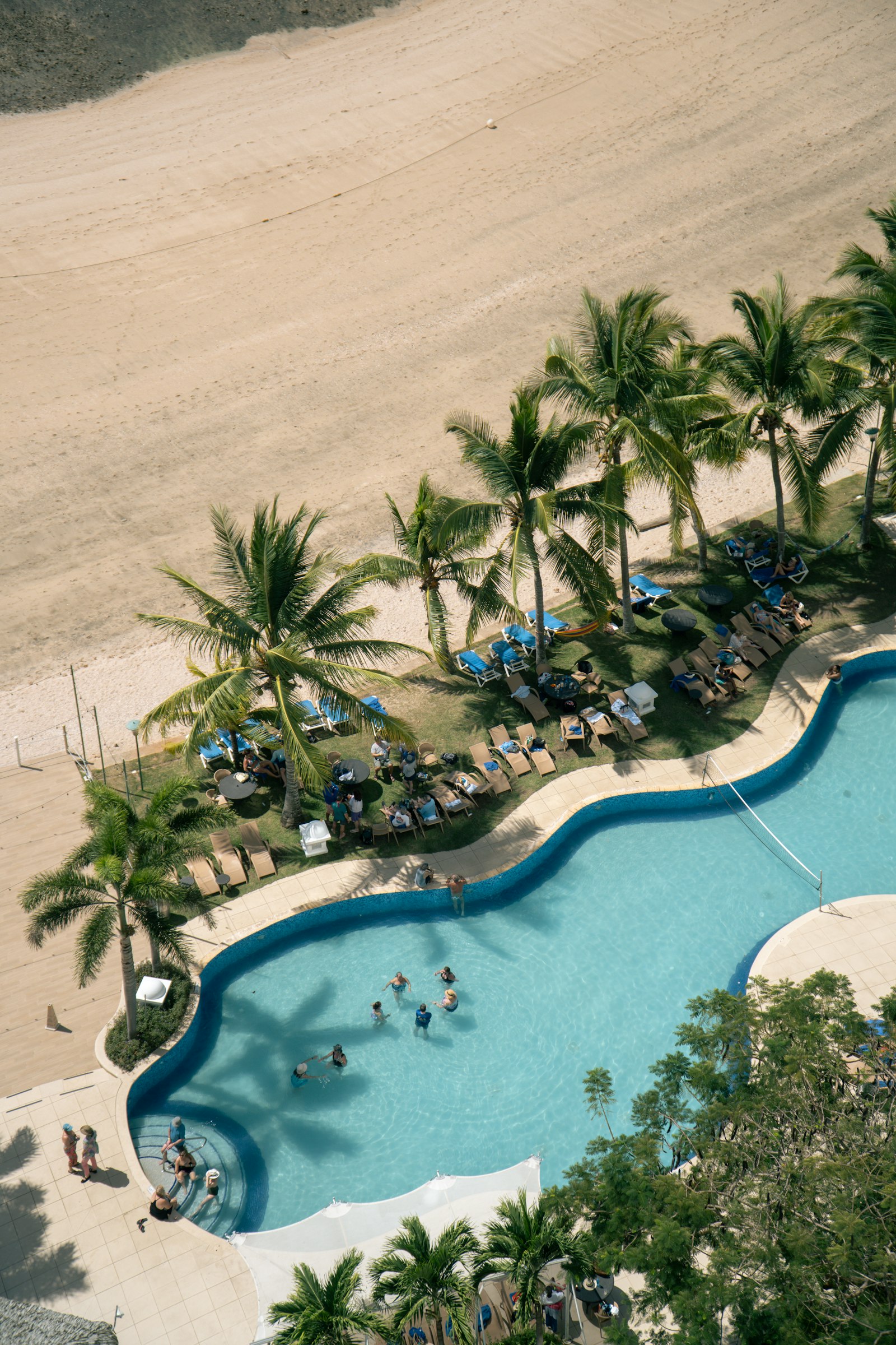 Aerial view of a tropical resort pool, illustrative image of the Occupation Double Panama villa setting