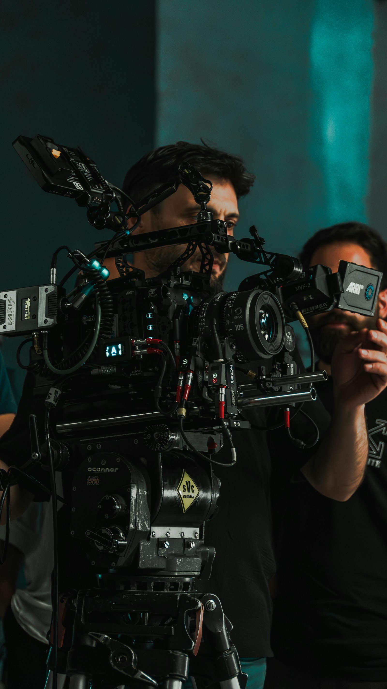 Cinematographer operating a professional video camera on set, preparing a holiday season brand video production in Montreal