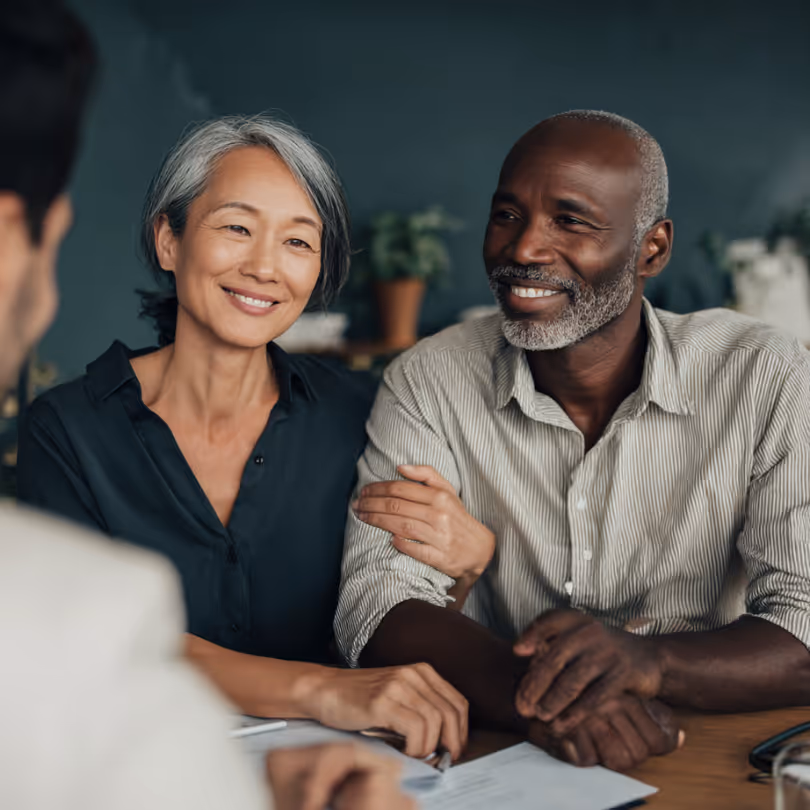 Couple in a meeting talking to an advisor