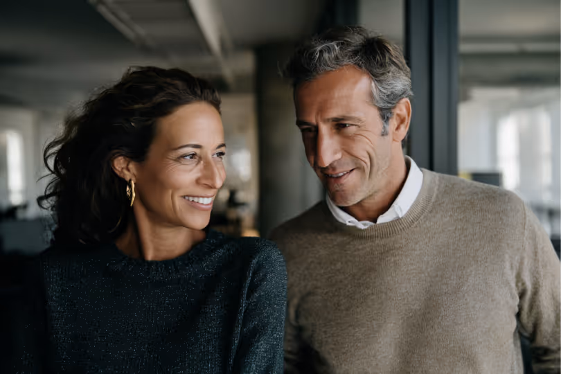 Couple smiling in an office